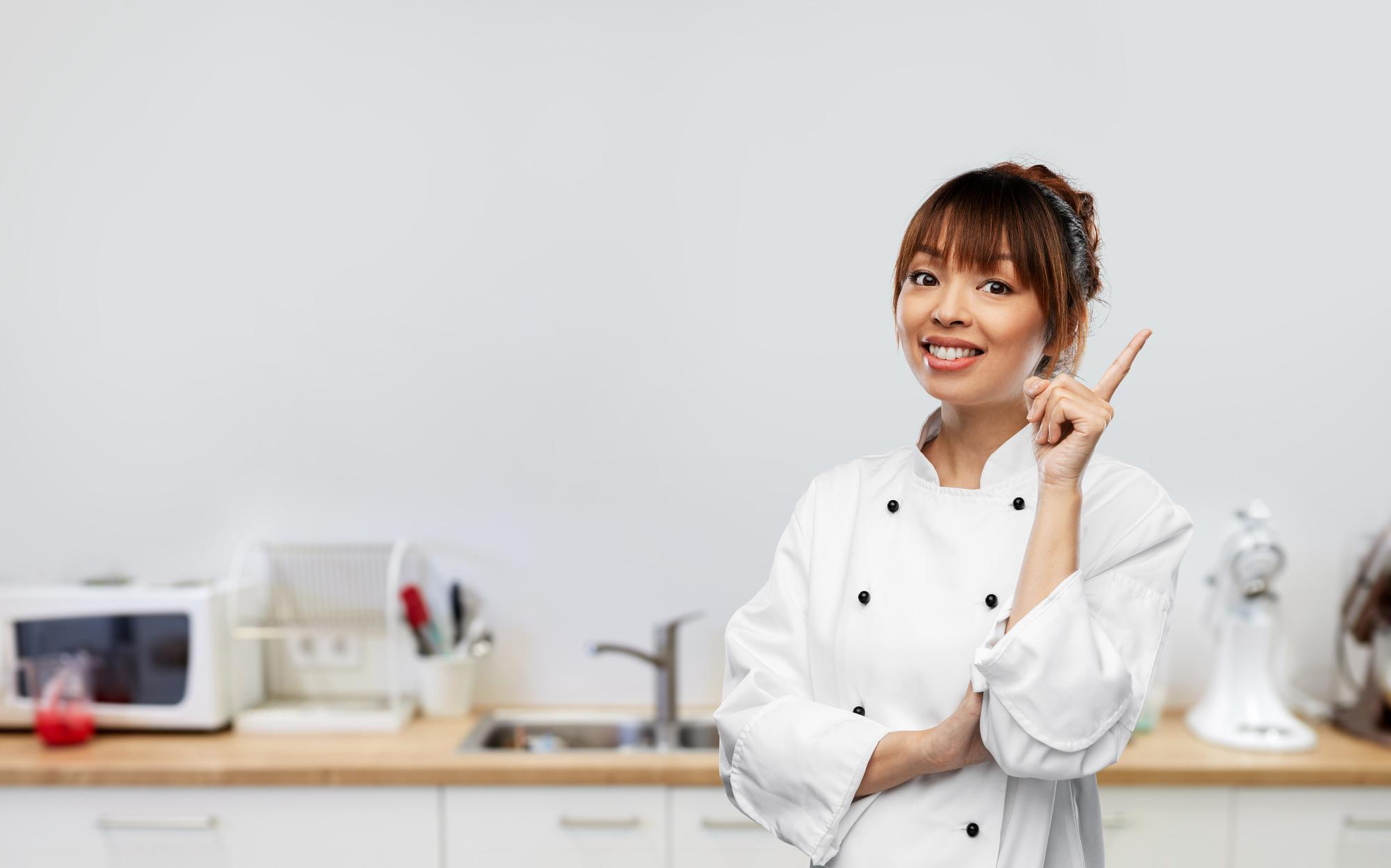 Coach smiling in a kitchen studio